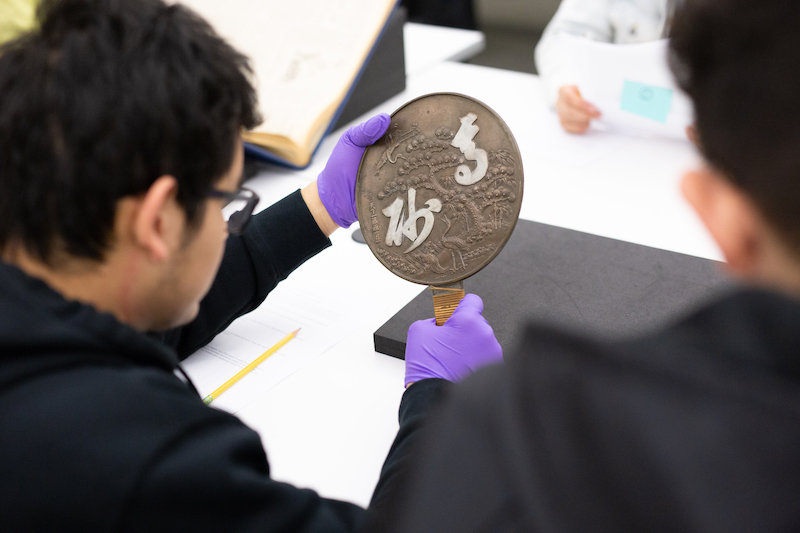 A Student holding mirror from Harry Honda Collection
